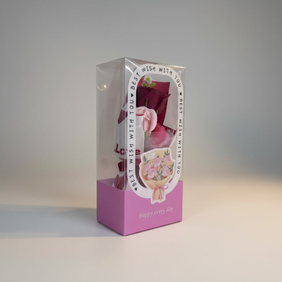 eRamis bouquet of artificial red and pink roses in a clear box with 'Love' and 'Happy every day' text.