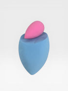 eRamis set of 2 makeup sponges, one blue teardrop shape and one pink smaller teardrop shape.