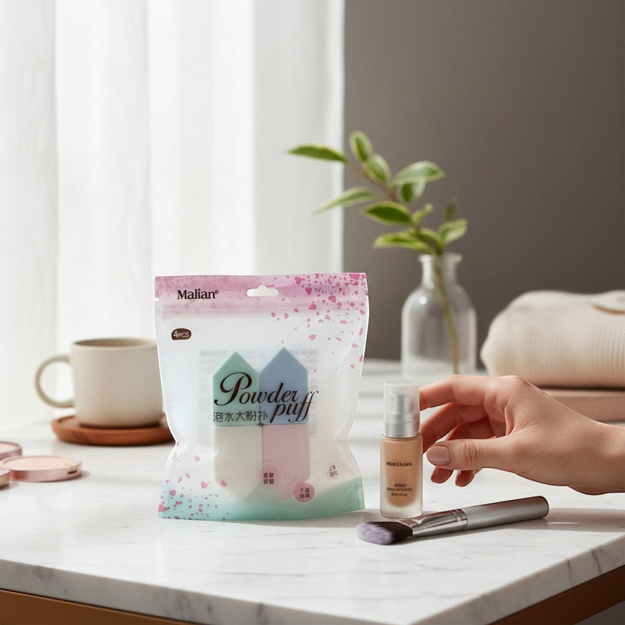 eRamis 4-piece set of triangular makeup sponges in pastel blue, mint green, white, and pink. Soft and comfortable for wet or dry use.
