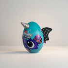 eRamis Monstercorn Surprise egg with teal colour, monster wings, and unicorn horn. Features a purple monster graphic.