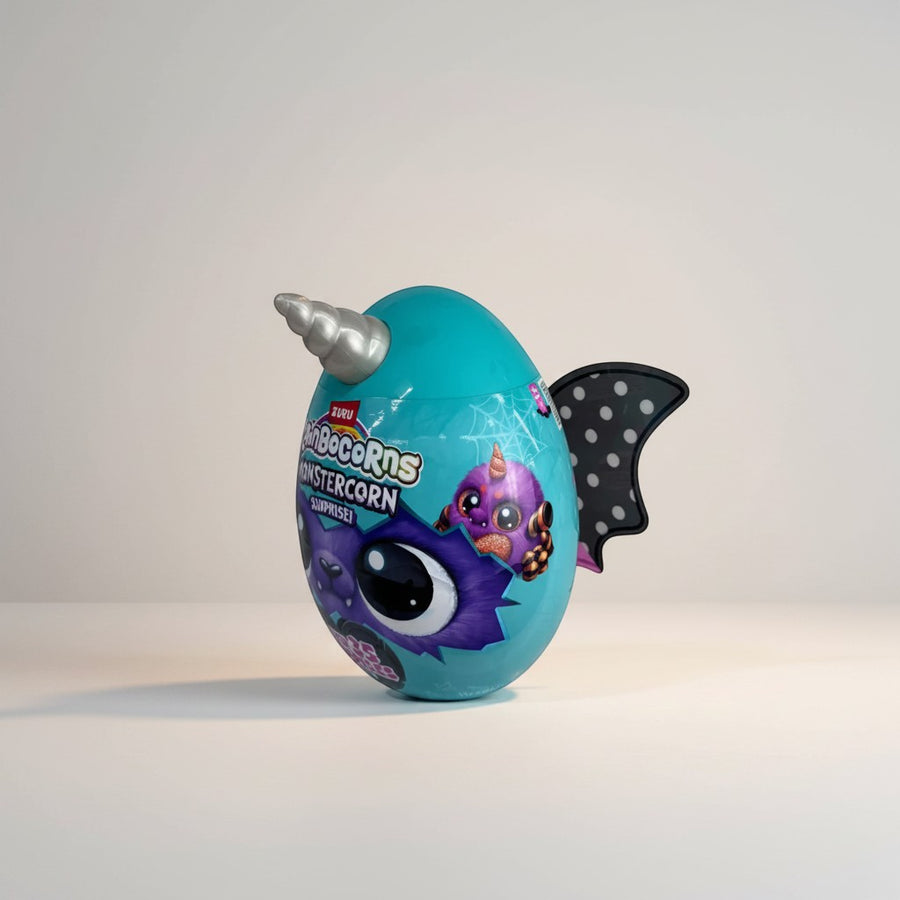 eRamis Monstercorn Surprise egg with teal colour, monster wings, and unicorn horn. Features a purple monster graphic.