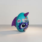 eRamis Monstercorn Surprise egg toy, teal with purple bat wings and horn, featuring a monster face.