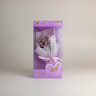 eRamis pink rose bouquet with small pink flowers, wrapped in white mesh and pink ribbon, in a purple box with hearts and the word "love".