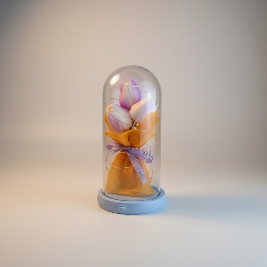 eRamis preserved purple and white tulips under glass dome with fairy lights and 'LOVE' ribbon.