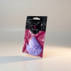 eRamis purple triangular makeup sponge with a soft texture and a ribbon strap for grip, packaged for retail.
