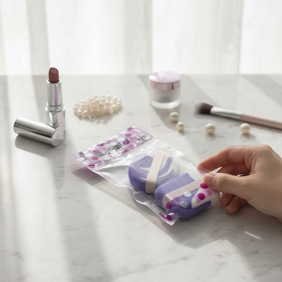 eRamis purple and white makeup sponges with pink ribbon detail. Ideal for foundation and powder application.