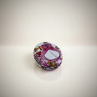 eRamis round compact mirror with floral print and pink ribbon detail. Features a decorative perfume bottle design.