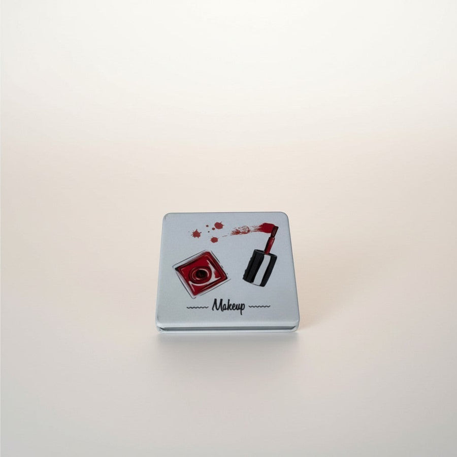 eRamis square makeup mirror with red nail polish design and text.