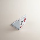 eRamis square compact mirror with makeup design, featuring lipstick and nail polish.