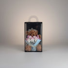 eRamis brown teddy bear wearing a tiara, holding a bouquet of pink and white roses, gift-boxed.