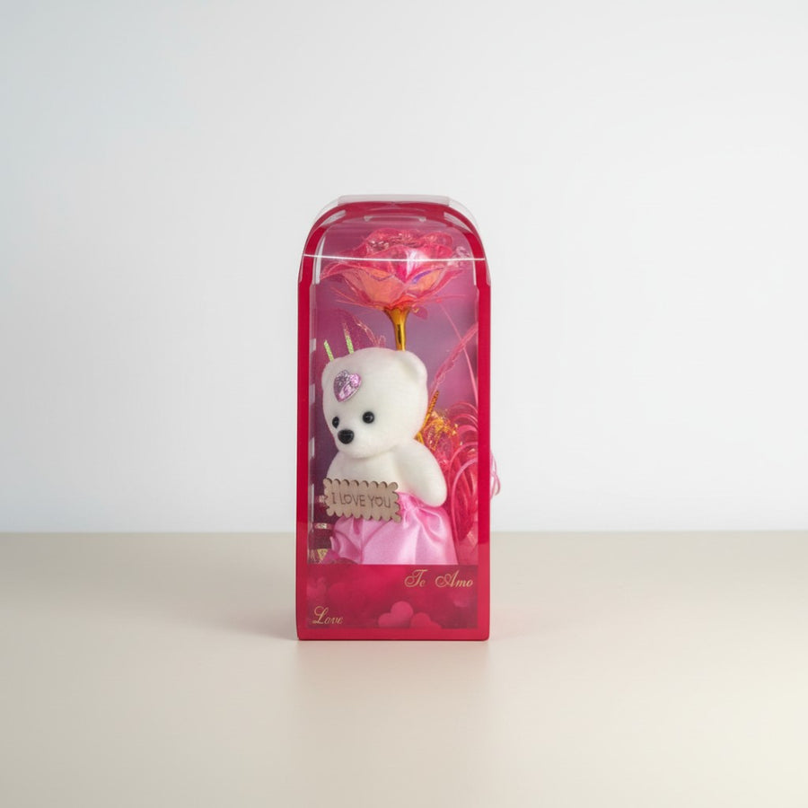 eRamis white teddy bear with pink dress and "I Love You" sign, inside a pink gift box with a rose.