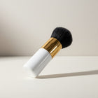 eRamis white handle makeup brush with gold ferrule and black bristles