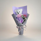 eRamis white teddy bear bouquet with purple rose, pink daisy, and "I Love You" heart.
