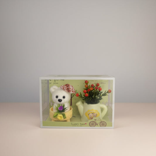 eRamis white teddy bear with red plaid hat and green floral decor in a yellow basket next to a watering can with flowers.