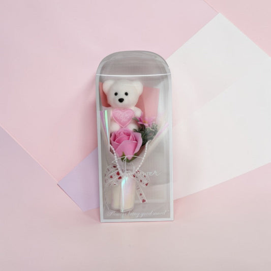 eRamis white teddy bear with pink rose bouquet, heart "I Love You" charm, pearl accents, and decorative ribbon.