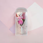 eRamis white plush teddy bear with pink 'I Love You' heart, holding a pink soap rose bouquet with pearl accents.