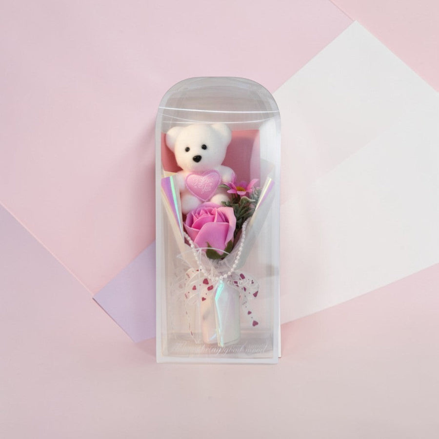 eRamis white plush teddy bear with pink 'I Love You' heart, holding a pink soap rose bouquet with pearl accents.