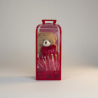 eRamisHere brown teddy bear holding a red heart with 'LOVE' embroidered, in a red gift box with ribbon.