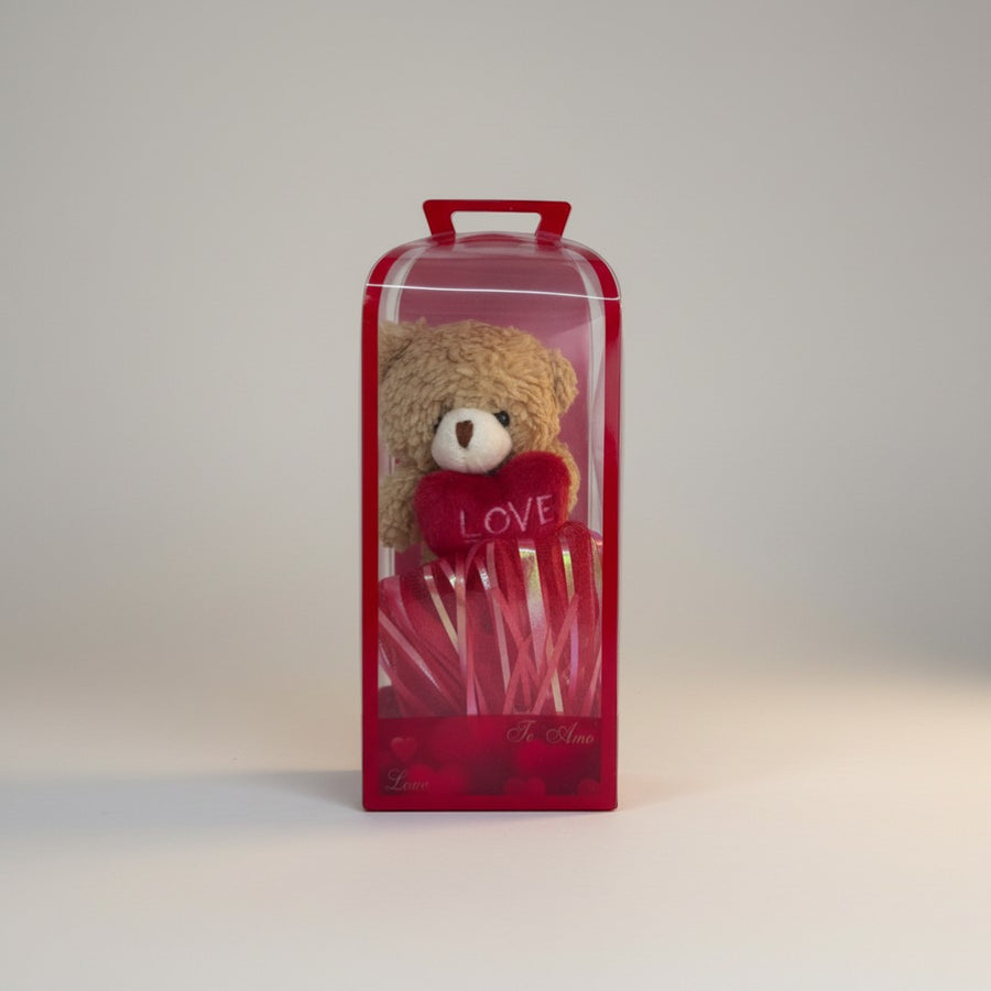 eRamisHere brown teddy bear holding a red heart with 'LOVE' embroidered, in a red gift box with ribbon.