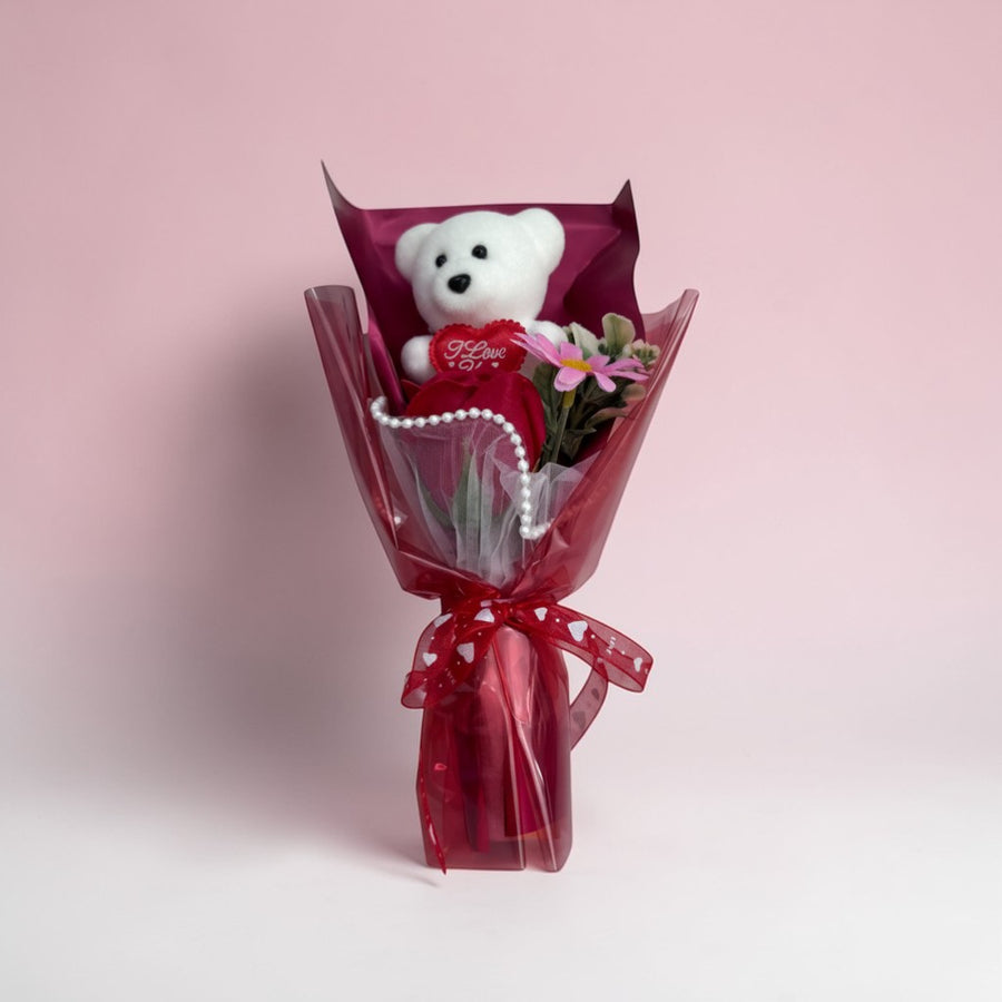 eRamisHere white teddy bear bouquet with red rose, pink flower, pearl accents, and red ribbon.