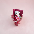 eRamisHere white plush teddy bear holding a red heart with 'I Love You' text, surrounded by a red rose and pink flower.