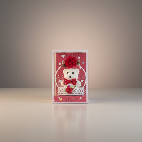 eRamisHere white teddy bear in a decorative basket with a red rose and bow, presented in a gift box.
