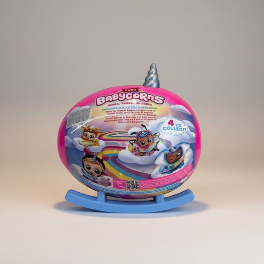 eRamisBabycorns Magical Rainbow Surprise Babies toy egg with unicorn horn, featuring cute baby characters on clouds and a rainbow.