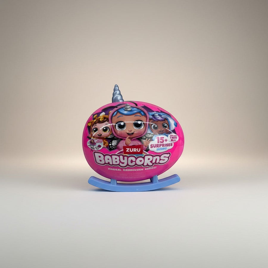 eRamis Babycorns toy with 15+ surprises inside, featuring cute unicorn babies on a pink egg-shaped package with a blue rocking base.