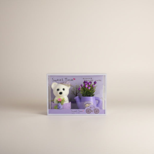 eRamis white teddy bear with purple and red floral decor in a watering can planter, "Sweet Time" theme.